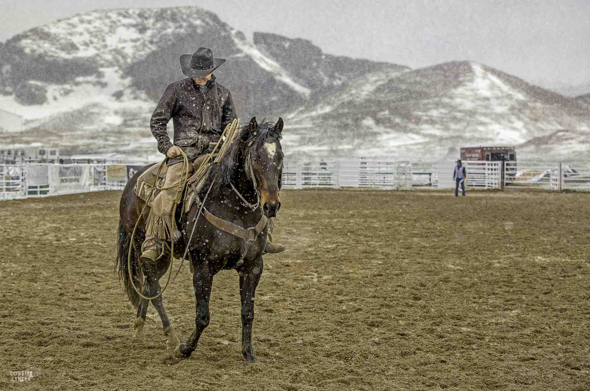 Pickup Man riding in a snowy arena